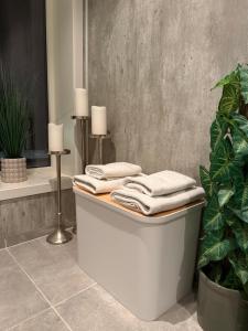a bath tub with towels on top of it in a bathroom at The View XL in Senja