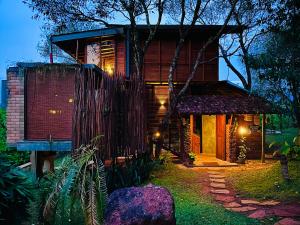 a house with a fence in front of it at Heavens Acres Lodge - Two Bed Room Cabana - Agarloom in Matale