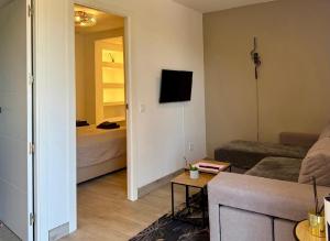 a living room with a couch and a bed at Casa Duseña Luna in Hondón de las Nieves