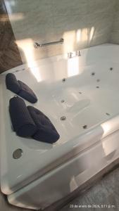 a white bath tub with two propellers on it at Hotel VIYAJE in Funza +27 photos