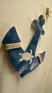 a blue star with a turtle on a wall at Frida Apartment in Chioggia