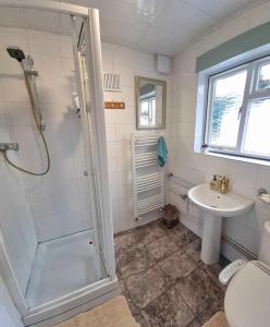 a bathroom with a shower and a sink at Canterbury within the city wall - Sleeps 7 - Pet-Friendly with Garden in Canterbury