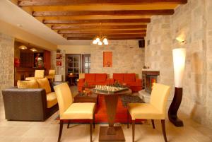 a living room with a couch and a fireplace at Mikri Arktos in Elati