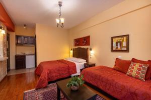 a hotel room with a bed and a couch at Mikri Arktos in Elati