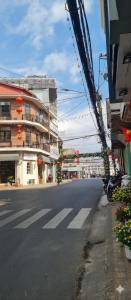 an empty street in a city with a building at Khu Hòa Bình in Da Lat