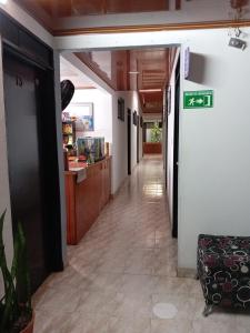 a hallway of a building with a hallwayasteryasteryasteryasteryasteryasteryasteryastery at Hospedaje Santa Bárbara in Buga