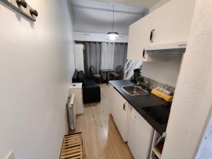 a kitchen with a sink and a counter top at Studio Duplex in Balaruc-les-Bains