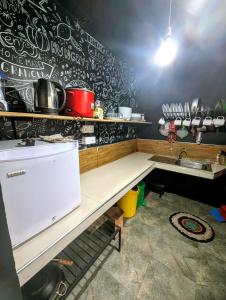 a kitchen with a counter and a sink in it at Relax Apartment Toppass in Nuwara Eliya