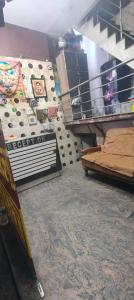a room with two beds and a wall at Panchmukhi inn hotel in Lucknow