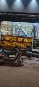 a motorcycle parked in front of a building at Panchmukhi inn hotel in Lucknow