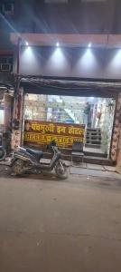 a motorcycle parked in front of a gas station at Panchmukhi inn hotel in Lucknow