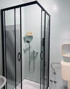 a shower with a glass door in a bathroom at Apartmány Júlia in Živogošće +72 photos