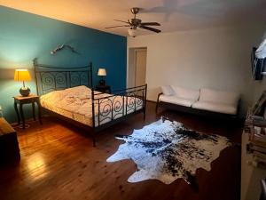 a bedroom with a bed and a rug on the floor at Villa Büyükada I Private Pier & Seawater Pool in Istanbul