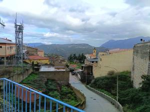 a view of a city with mountains in the background at Locanda B&B Dandana in Orgosolo