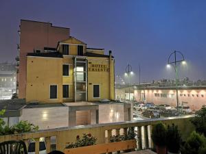 a hotel with a sign on the side of a building at Dimora Venice Station in Mestre