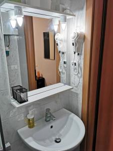 a bathroom with a sink and a mirror at Dimora Venice Station in Mestre +118 photos