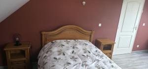 a bedroom with a bed and two night stands at Chambre proche circuit 24h du mans in Spay +3 photos