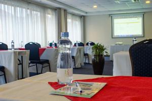 a bottle of water sitting on top of a table at Hotel Rio in Nairobi