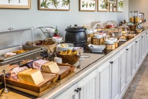 a buffet line with many different types of food at Nemi Boutique Hotel in Baku