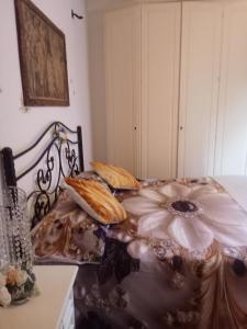 a bedroom with a bed with a flower painted on it at Villa Rosa in Acqualagna +87 photos