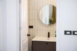 a bathroom with a sink and a mirror at Travellers Palm in Ko Phangan