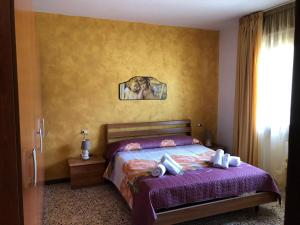 a bedroom with a bed with a dog in a mirror at La Presentosa in Ortona
