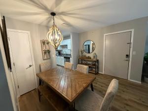 a dining room with a wooden table and chairs at Branson Ridge Retreat in Branson