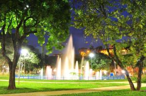 a fountain in a park at night at kit net central 2 in Serra Negra