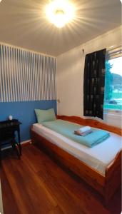 a bedroom with a bed with a light on the ceiling at Stryn Norway in Stryn +12 photos