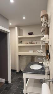 a bathroom with a sink and a counter at La Luna Guesthouse in Bruges +45 photos