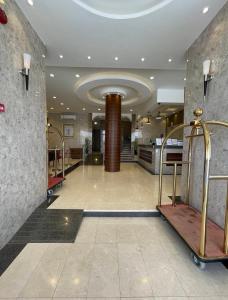 a lobby of a building with a lobbyasteryasteryasteryasteryasteryasteryasteryastery at اجنحة سبات الفندقيه in Ahad Rafidah