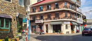 a building on a city street with a building at Khu Hòa Bình in Da Lat