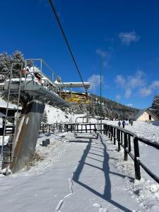 a ski lift going over a snow covered slope at Lecine 73 in Gioia dei Marsi +6 photos