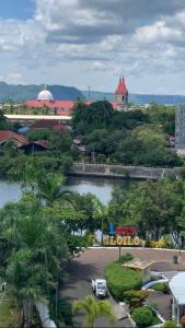 a car parked in a parking lot next to a river at Executive Family Condo Unit in Iloilo City