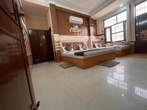 a large room with a bed in the middle of it at VATS VILLA "Feels like Home & Facilitates like Hotel" in Vrindāvan