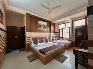a bedroom with two beds in a room at VATS VILLA "Feels like Home & Facilitates like Hotel" in Vrindāvan