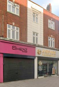 a store on the corner of a street at Midnight Horizon - shared bathroom in Ponders End