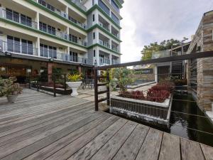 a wooden deck in front of a building at Dream'Star Resort in Puerto Galera