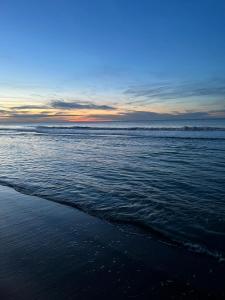 a view of the beach with the ocean at JuLieze Apartment at Sea & Pool in Ostend