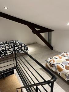 a bedroom with a bunk bed in a room at Maison f2 avec cour privative in Montceau-les-Mines