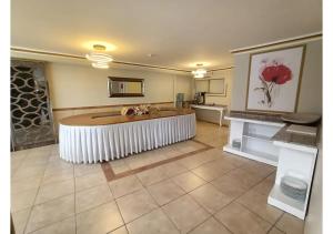 a large kitchen with a large tub in a room at Elit Lara Otel in Salihli