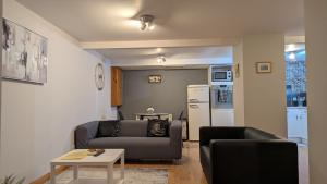 a living room with a couch and a table at One bedroom self-contained accommodation in Lerwick
