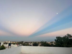 a rainbow in the sky over a city at Casa Analco Durango in Durango
