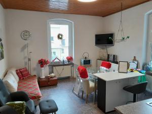 a living room with a couch and a table at Ferienwohnung Springstein in Aue