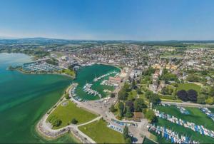 an aerial view of a town next to a body of water at Luxuswohnung in Bodensee, im Radweg mit Parkplatz in Romanshorn