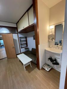 a small bathroom with a sink and a mirror at Modern style old house in Nagoya +38 photos