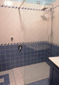 a shower with a glass door in a bathroom at Casa Clelia - Sulla strada per il lago in Rezzato +13 photos