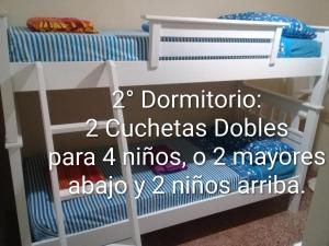 a bunk bed with the words dominato cottagesddsapa m at Vergniaud 70 in Colón +48 photos