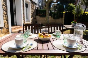 a wooden table with a bowl of fruit on it at Arbide House in Leioa