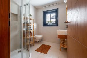 a bathroom with a shower and a toilet and a sink at Chata Drienka in Terchová +46 photos